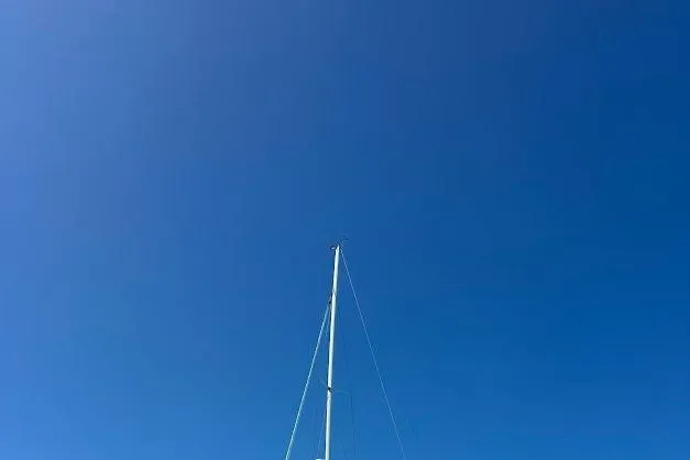 Slide: The Image of Sailboat mast against clear blue sky, Bavaria 42, 2001 model. - 65