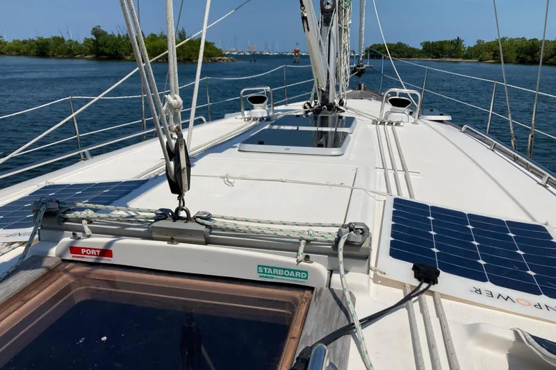 Slide: The Image of Deck view of 2001 Bavaria 43 Cruiser sailboat with solar panels and rigging. - 7