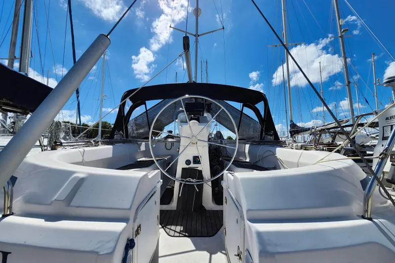 Slide: The Image of Cockpit view of 2001 Bavaria 43 Cruiser sailboat under a clear blue sky. - 9
