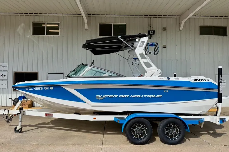 Slide: The Image of 2018 Nautique Super Air Nautique GS20 boat on trailer, parked outdoors. - 1
