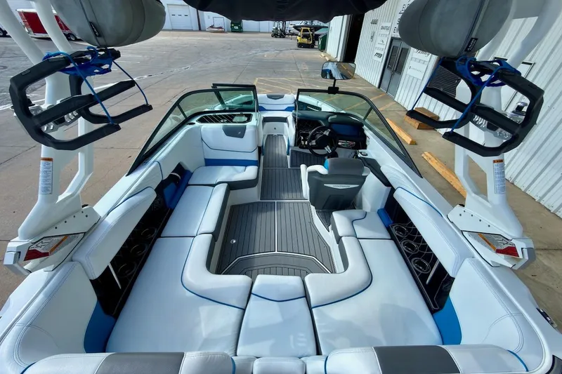 Slide: The Image of 2018 Nautique Super Air Nautique GS20 interior with white and blue seating. - 11