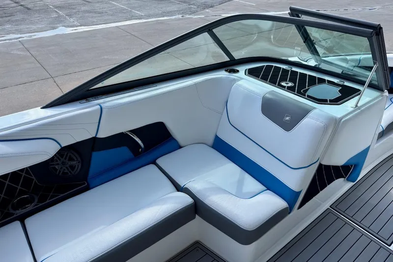 Slide: The Image of Interior of 2018 Nautique Super Air Nautique GS20 boat, featuring seating and storage area. - 13