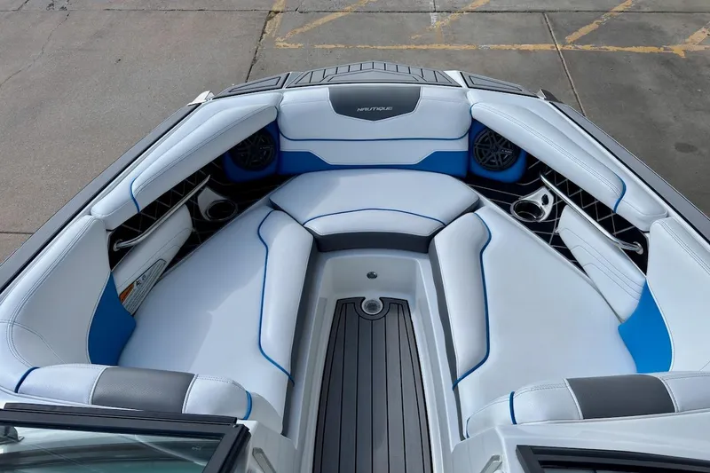 Slide: The Image of Interior view of 2018 Nautique Super Air Nautique GS20 boat, featuring seating and speaker. - 14