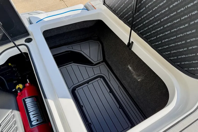 Slide: The Image of Wakeboard rack on 2018 Nautique Super Air Nautique GS20 boat, near service entrance. - 24