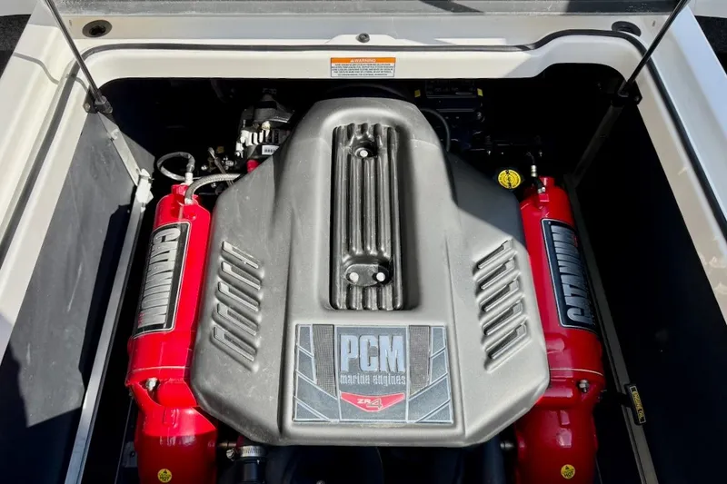 Slide: The Image of 2018 Nautique Super Air Nautique GS20, blue and chrome detailing, close-up view. - 26