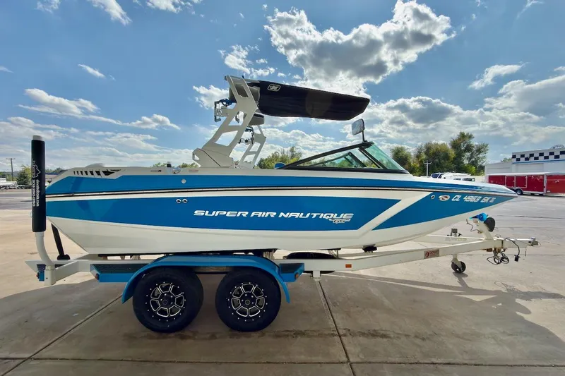 Slide: The Image of 2018 Nautique Super Air Nautique GS20 interior with blue and white seating, sleek design. - 8