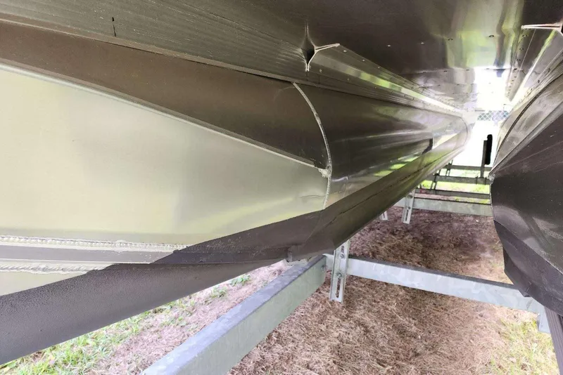 Slide: The Image of 2022 Avalon GS Rear Fish pontoon boat underside on trailer. - 18