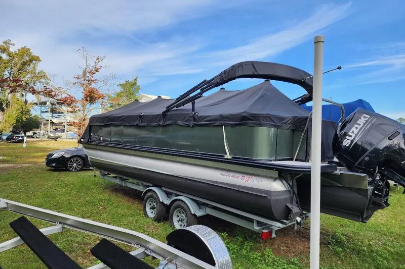 Slide: The Image of 2022 Avalon GS Rear Fish 23' pontoon boat on trailer with Suzuki outboard motor. - 19