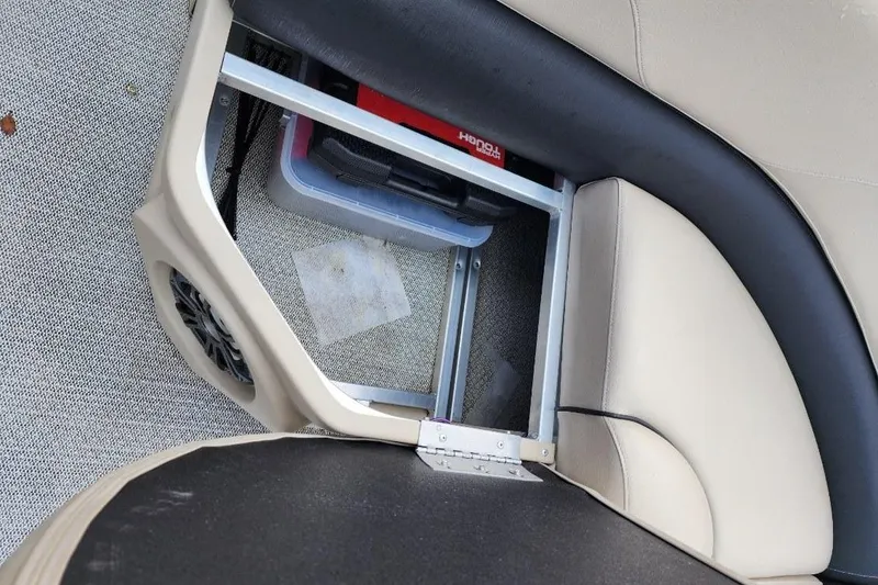 Slide: The Image of Storage compartment in 2022 Avalon GS Rear Fish boat with beige seating. - 25