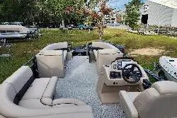 Slide: The Image of 2022 Avalon GS Rear Fish 23' pontoon boat with spacious seating and modern dashboard. - 28