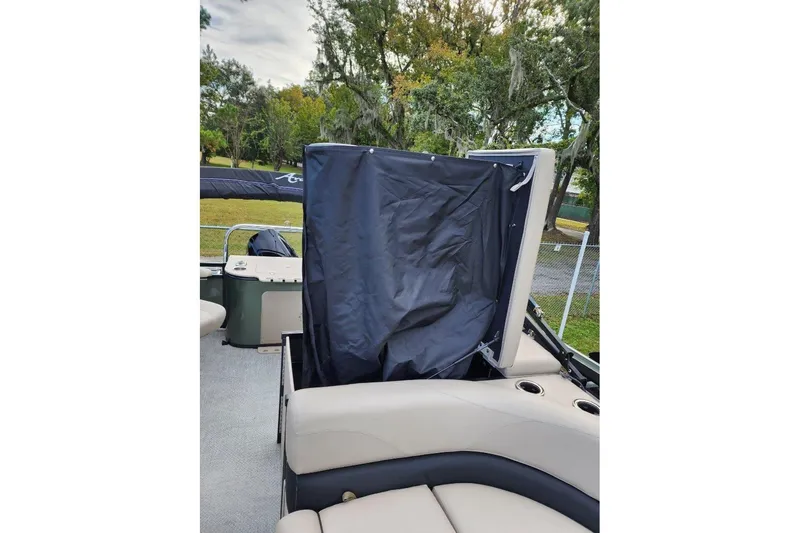 Slide: The Image of 2022 Avalon GS Rear Fish boat interior with seating and storage compartment. - 3