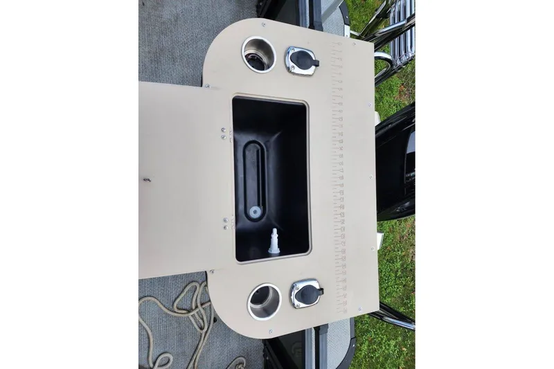 Slide: The Image of 2022 Avalon GS Rear Fish boat console with cup holders and storage compartment. - 33