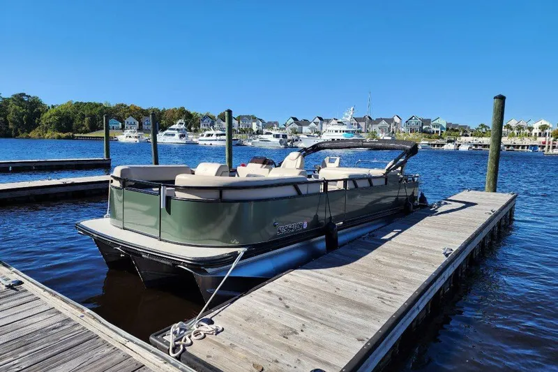 Slide: The Image of 2022 Avalon GS Rear Fish 23' pontoon boat docked at marina. - 36