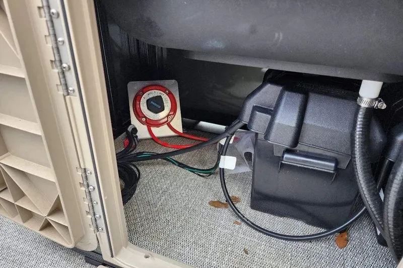 Slide: The Image of Battery compartment of 2022 Avalon GS Rear Fish 23' boat with wiring and switch. - 4