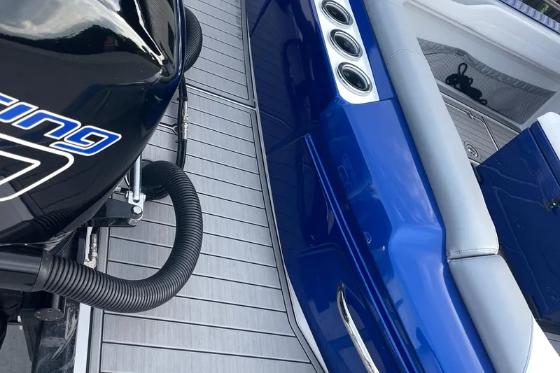 Slide: The Image of 2022 Nor-Tech 340 Sport Center Console boat interior with blue and gray seating. - 10