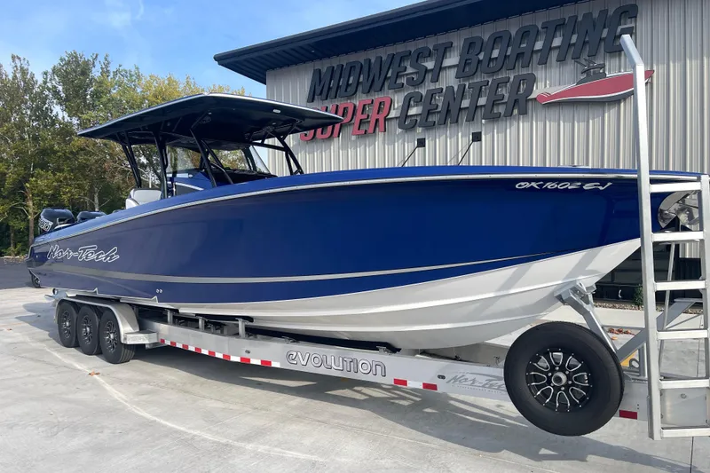 Slide: The Image of 2022 Nor-Tech 340 Sport Center Console boat on trailer at Midwest Boating Center. - 2