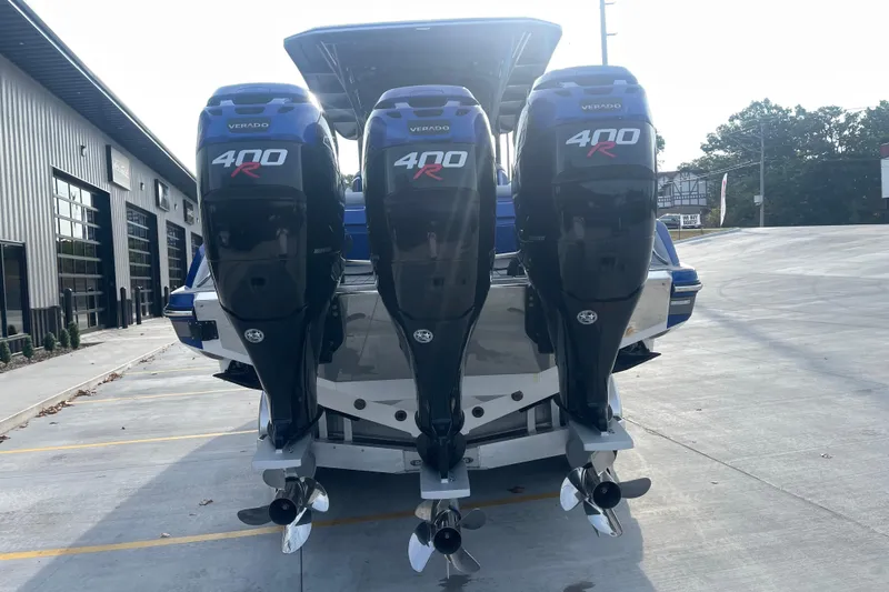 Slide: The Image of 2022 Nor-Tech 340 Sport Center Console with triple Mercury 400R outboard engines. - 4