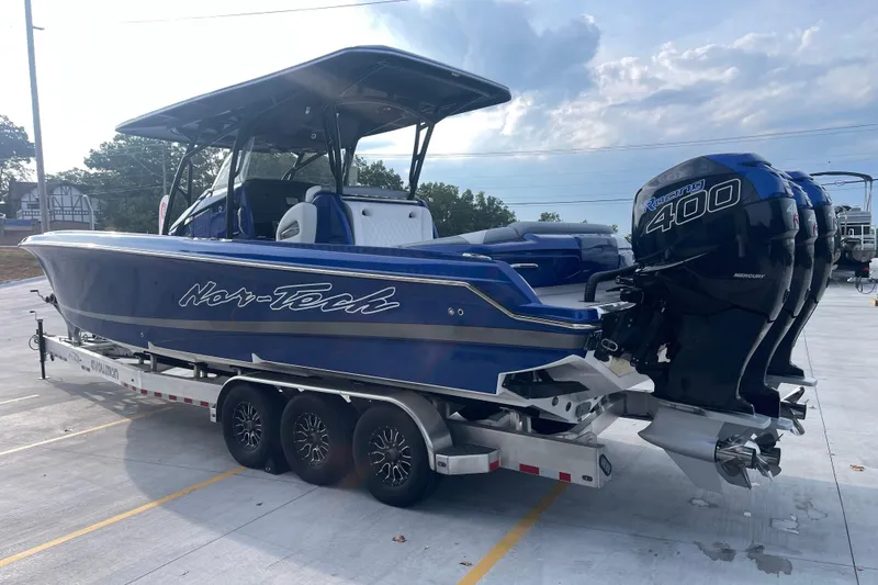 Slide: The Image of 2022 Nor-Tech 340 Sport Center Console boat with triple Mercury Racing 400 engines. - 6