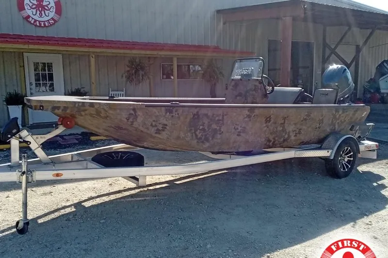 The Image of 2025 Thor 1900 Lake Hammer boat on trailer outside a building. - 1