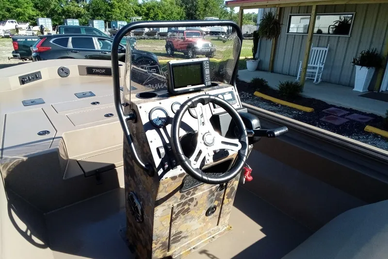 Slide: The Image of Steering console of 2025 Thor 1900 Lake Hammer boat with navigation system. - 12