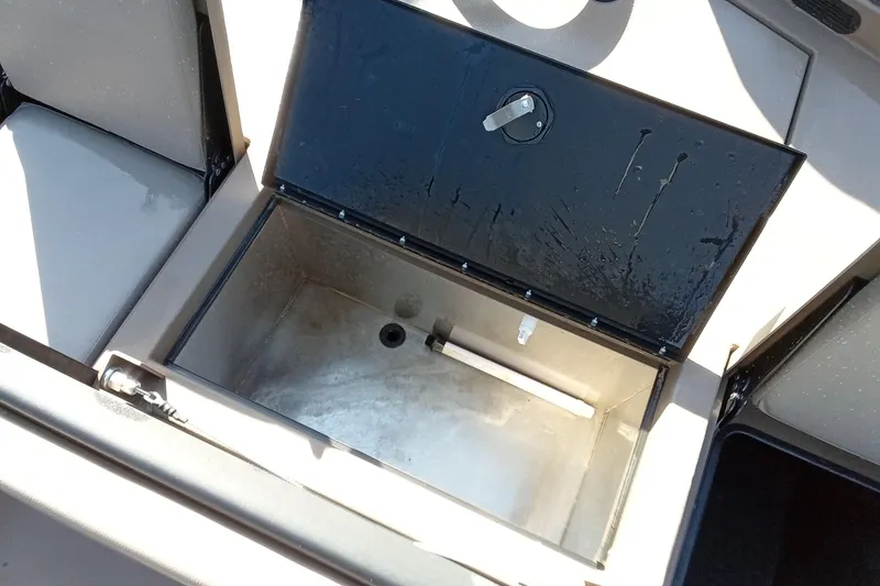 Slide: The Image of Open storage compartment in 2025 Thor 1900 Lake Hammer boat, showing interior details. - 19