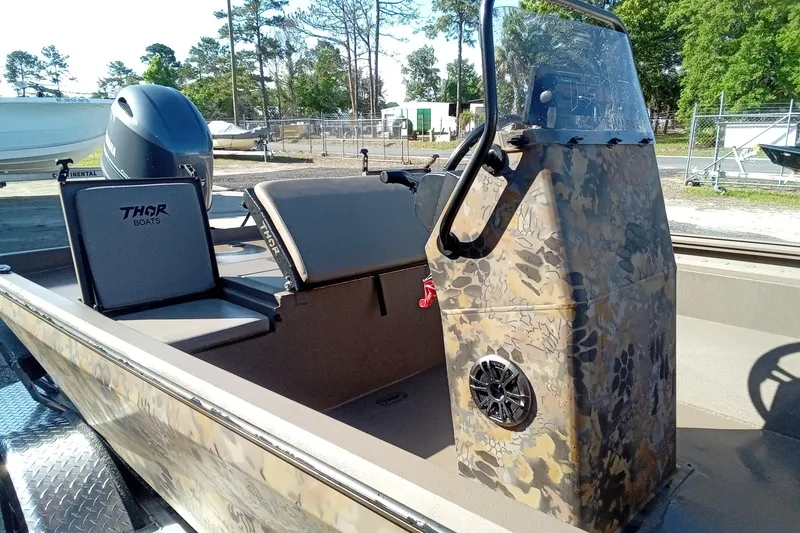 Slide: The Image of 2025 Thor 1900 Lake Hammer boat with camouflage console and seating. - 6