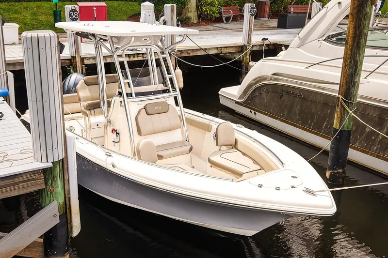 Slide: The Image of 2022 Key West 219 FS boat docked at marina, featuring sleek design and comfortable seating. - 1