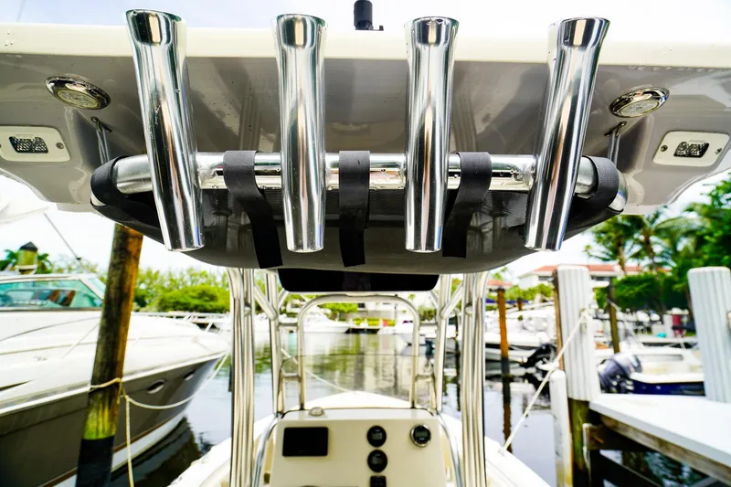 Slide: The Image of 2022 Key West 219 FS boat with rod holders at marina. - 11