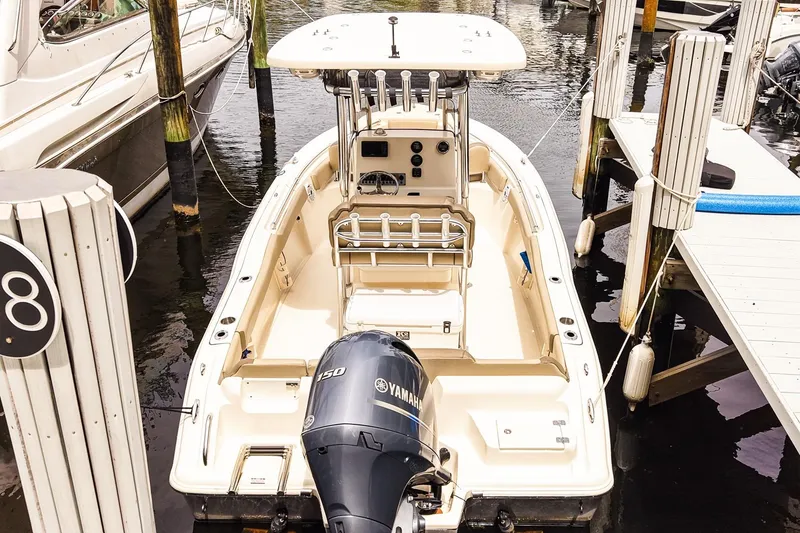 Slide: The Image of 2022 Key West 219 FS boat docked with Yamaha engine, viewed from above. - 3