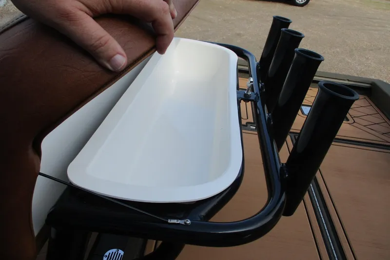 Slide: The Image of 2026 Avid 20 ROGUE CC boat with rod holders and storage compartment. - 17