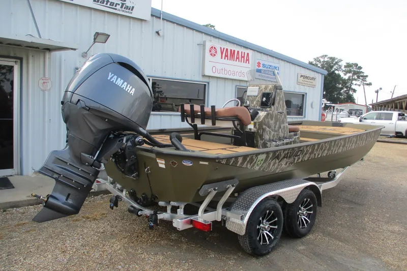 Slide: The Image of 2026 Avid 20 ROGUE CC boat with Yamaha outboard motor on trailer. - 2