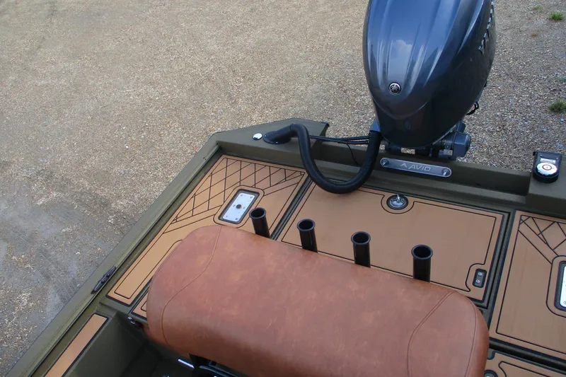 Slide: The Image of 2026 Avid 20 ROGUE CC boat interior with motor and seating detail. - 20