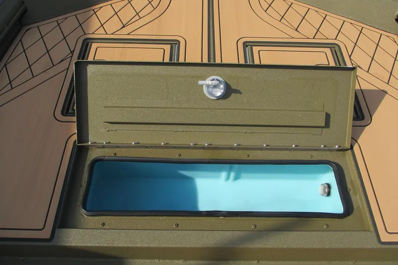 Slide: The Image of Open storage compartment on 2026 Avid 20 ROGUE CC boat deck. - 8