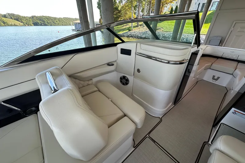 Slide: The Image of 2022 Regal LS6 boat cruising on open water, showcasing sleek design and performance. - 11