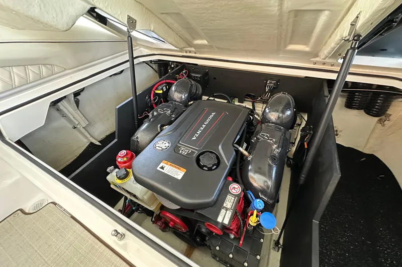 Slide: The Image of 2022 Regal LS6 boat cruising on a lake, showcasing sleek design and performance. - 13