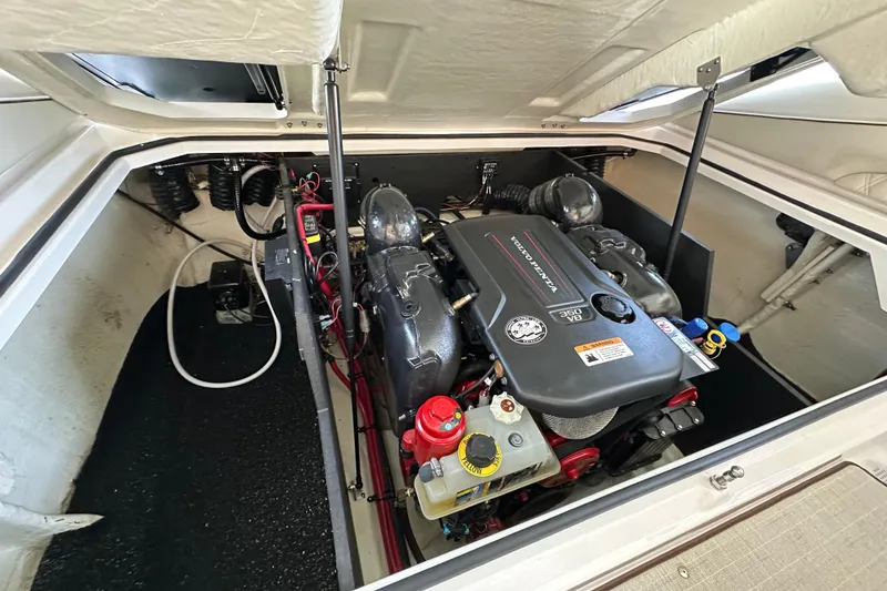 Slide: The Image of 2022 Regal LS6 boat cruising on a lake, leaving a wake behind. - 14