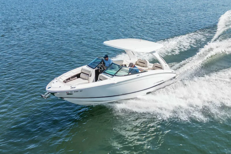 Slide: The Image of 2022 Regal LS6 boat cruising on open water, creating a wake. - 16