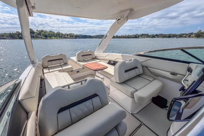 Slide: The Image of Luxurious interior of 2022 Regal LS6 boat with comfortable seating and scenic water view. - 24