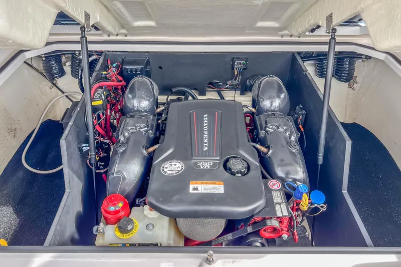 Slide: The Image of 2022 Regal LS6 engine compartment featuring a Volvo Penta V8 350 engine. - 31