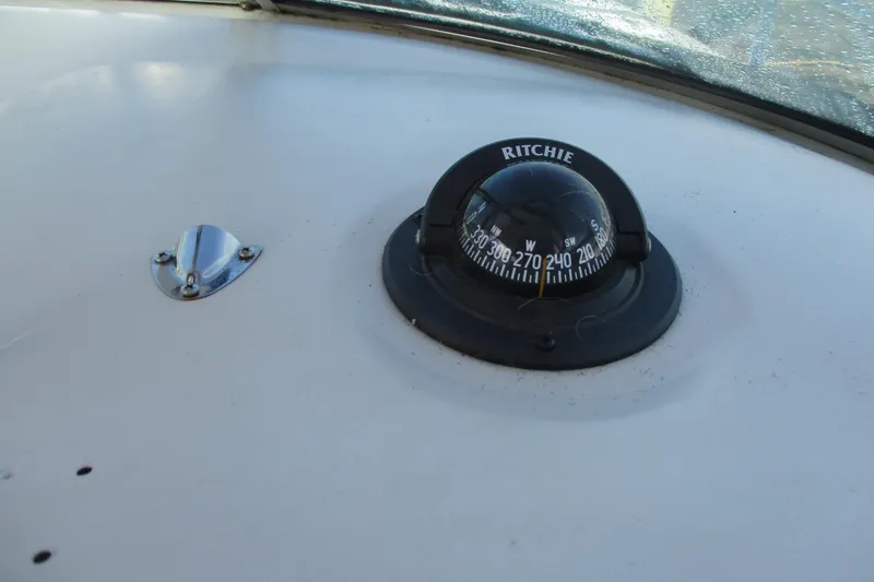 Slide: The Image of Compass on 2000 Sea Ray 240 Sundancer boat dashboard. - 9