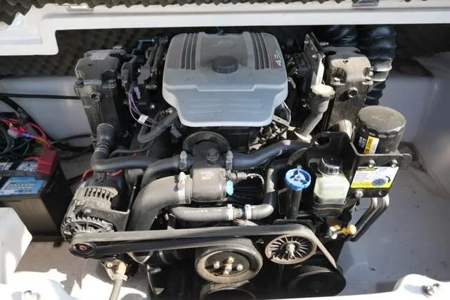 Slide: The Image of 2011 Tahoe Q5SI engine compartment with visible components and wiring. - 15