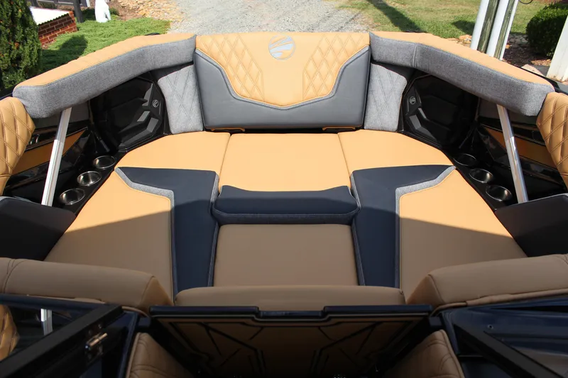 Slide: The Image of 2026 Tigé 24RZX boat interior with luxurious tan and gray seating. - 15
