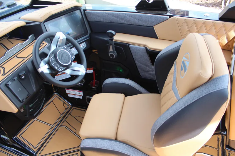 Slide: The Image of 2026 Tigé 24RZX boat interior with modern dashboard and luxurious seating. - 17