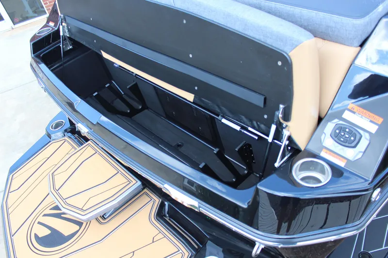 Slide: The Image of 2026 Tigé 24RZX boat with open storage compartment and sleek design details. - 20