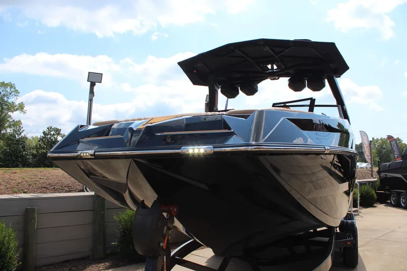 Slide: The Image of 2026 Tigé 24RZX boat with sleek design and modern features, displayed outdoors. - 8