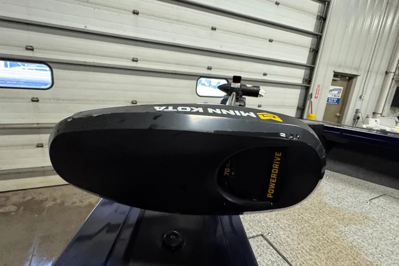 Slide: The Image of 2024 Tracker Targa V-19 Combo boat interior with carpeted deck and equipment. - 14