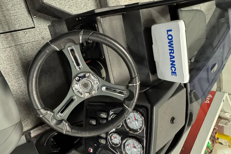 Slide: The Image of 2024 Tracker Targa V-19 Combo dashboard with Lowrance system and gauges. - 9