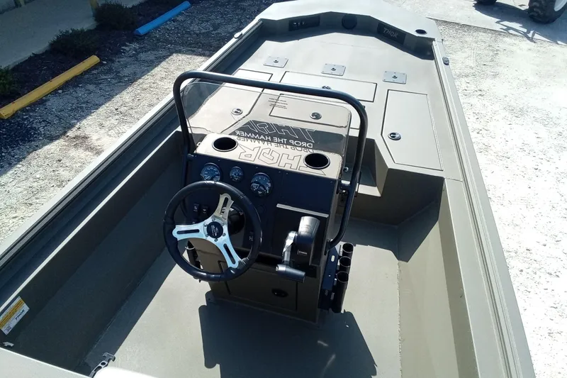 Slide: The Image of 2025 Thor 1900 Lake Hammer boat interior with steering console and controls. - 12