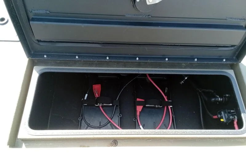 Slide: The Image of Open battery compartment of 2025 Thor 1900 Lake Hammer with visible wiring. - 16
