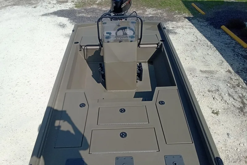 Slide: The Image of 2025 Thor 1900 Lake Hammer boat interior with storage compartments and steering console. - 17